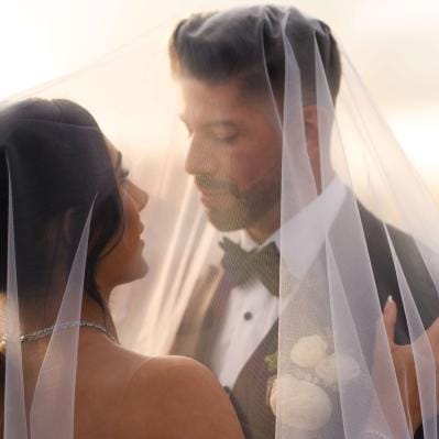 Donya and Rick embrace against scenic Seattle backdrop
