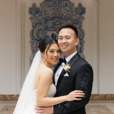 Thao and Corey smile and pose on their wedding day at Rancho Las Lomas