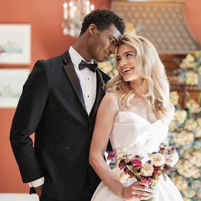 Models pose in an embrace in styled shoot at Maxwell Mansion