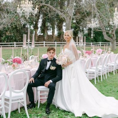 Model bride and groom in classic, chic wedding attire with blush, elegant reception table at Walnut Grove styled shoot