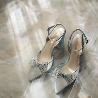 Model and pair of silver bridal Bella Belle Shoes from the Champagne Era collection