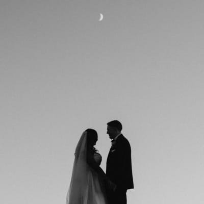 Tsion and Ben stand looking at each other under the moon. 