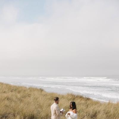 Bride and groom exchange vows in oceanside elopement