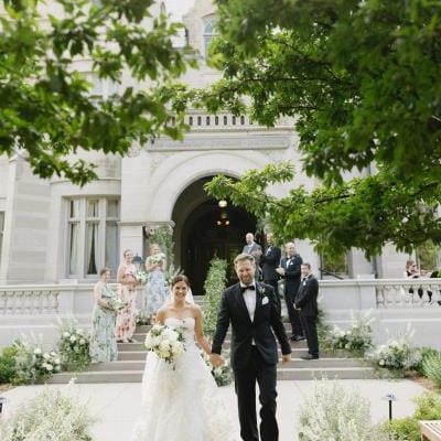 Bride and Groom walk back down aisle at the American Swedish Institute