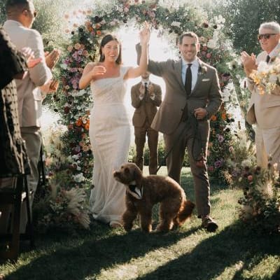 Sarah, David and their dog Miles celebrated their special day with bright sunshine and flowers at Stonewall Ranch.