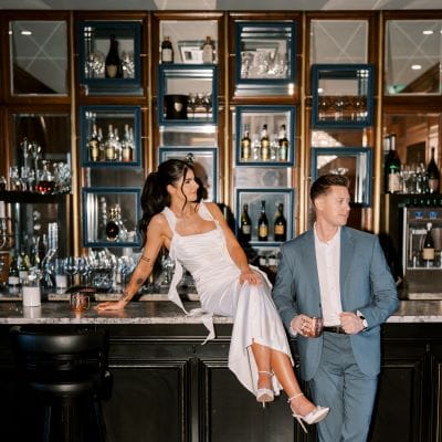 Moody-chic engagement session with a blue and orange color scheme at Wrigley Mansion
