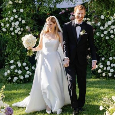 Bride and groom walk back down aisle at the end of enchanted garden wedding ceremony at The Lodge at Malibou Lake