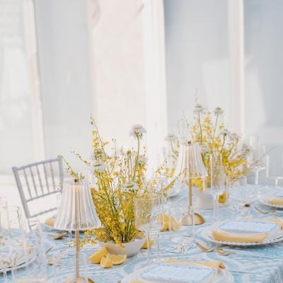 Amalfi Coast-inspired tablescape featuring bright yellow and blue hues