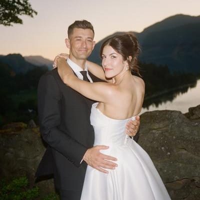 Bride and groom embrace during sunset at The Griffin Hosue