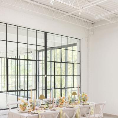 Light and airy tablescape featuring a palette of soft pastels, local blooms and vegetable details at The Whim