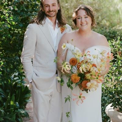 Bride and groom pose, smiling side by side in Santa Fe wedding day at private estate