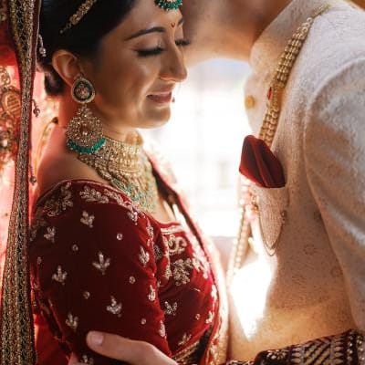 Bride and groom embrace in their traditional Indian garb in wedding day at Lairmont Manor