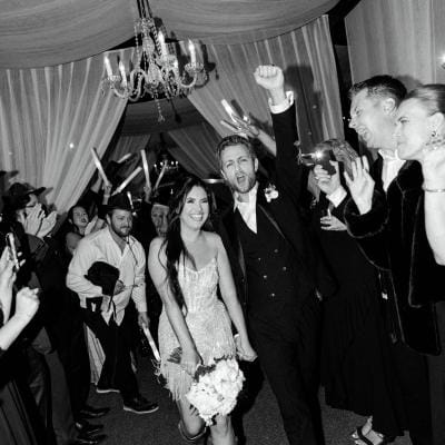 Bride and groom make their grand exit in fashion-forward wedding day at Ever After Ranch