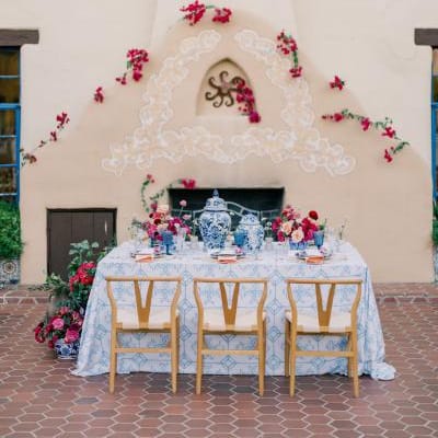 Bold and romantic reception table framed by the storied Hacienda del Sol