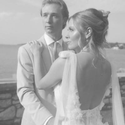 Bride and groom pose on the grounds of Alpine Resort