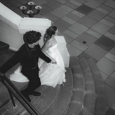 Bride and groom descend staircase at Maryhill Museum of Art