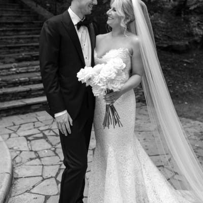Bride and groom share a loving glance on the grounds outside of Livestock Exchange Ballrooms in Omaha