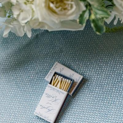 Custom matchbooks on blue tablecloth