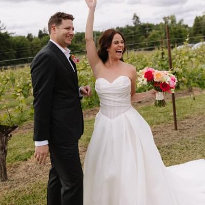 Amanda and Sam cheer on their wedding day at Oswego Hills Winery