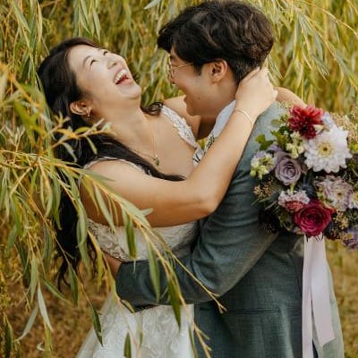 Patty and David embrace and share laughter on the grounds of Twin Willows