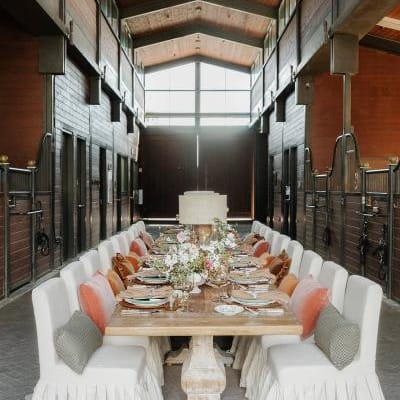 Earthy tablescape in the midst of a horse barn at TERI campus of life