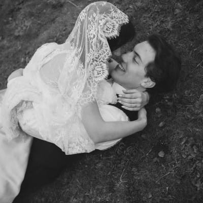 Mykayla and Jake roll in the beach grass during their elopment