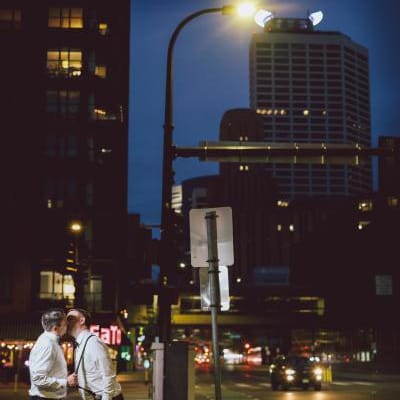 Matt and Luke embrace on the streets of Minneapolis