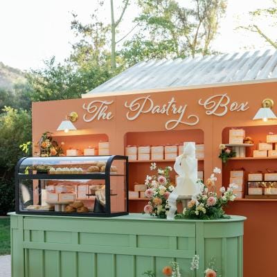 Colorful pastry box escort card display 