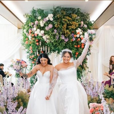 Enya and Elle walk back down the aisle after I do's at Equestria West