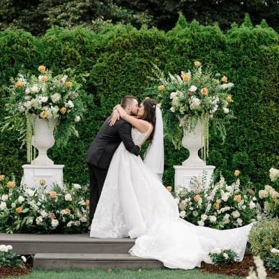 Paige and Nick seal their vows with a kiss in outdoor ceremony at Columbia Collective