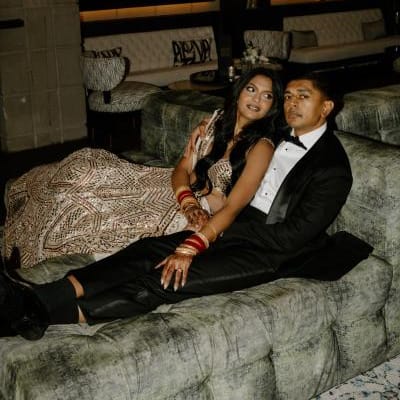 Nikita and Sahil pose before their reception in their opulent attire