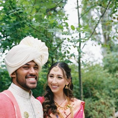 Mady and Sahil smile and pose in their wedding day attire (day one)