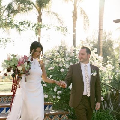 Hamida and brett descend a staircase at La Lomita Ranch