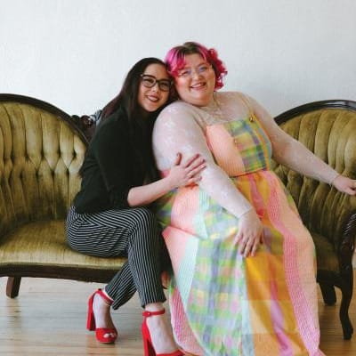 Owners of Honeybee Bridal pose for a photo 
