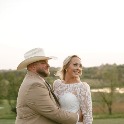 Monica and Matt pose in their wedding attire at their private residence 
