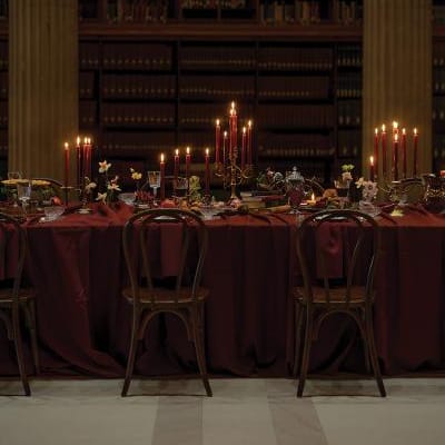 Candlelit reception table in wine hues at Avalon