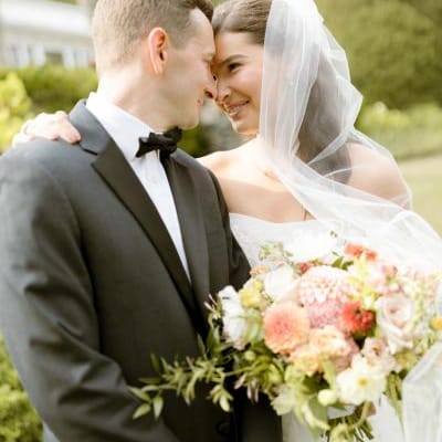 Tom and Clare embrace on their wedding day at Alpine REsort