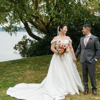 Jane and Abner pose in their wedding attire on the grounds of The Woodmark Hotel & Still Spa