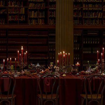 Candlelit reception table in wine hues at Avalon