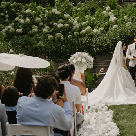 Jenny and Joseph stand at the outdoor altar during ceremony at Villa Terrace