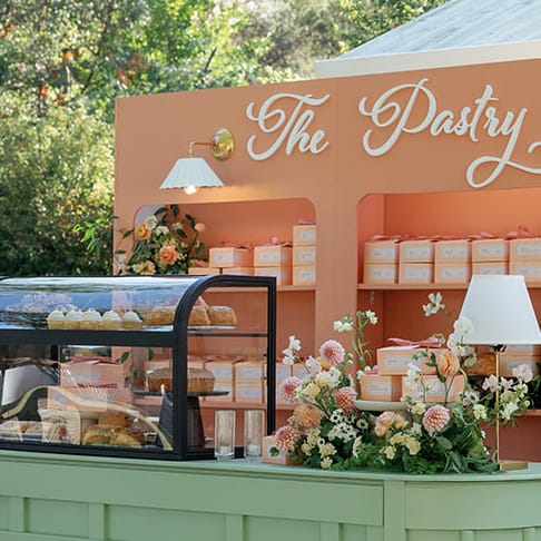 Colorful pastry box escort card display 
