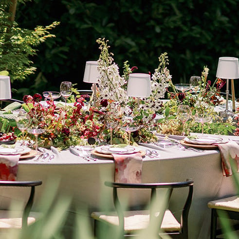 Luxe tablescape pairing hyper-seasonal blooms and rich textures in yin-yang inspired design at Parties on the Terrace