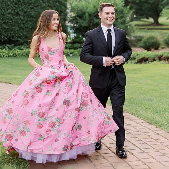 Bride and groom pose together on their winning wedding day