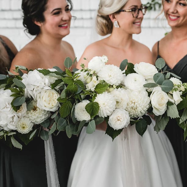 bridesmaids with white bouquets