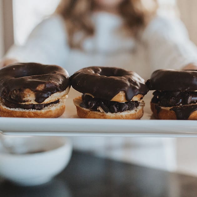 Chocolate frosting on donuts served with Wesley Andrews coffee
