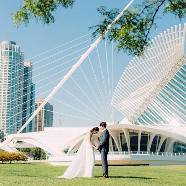 Bride and groom stand before the Quadracci Pavilion at the Milwaukee Art Museum