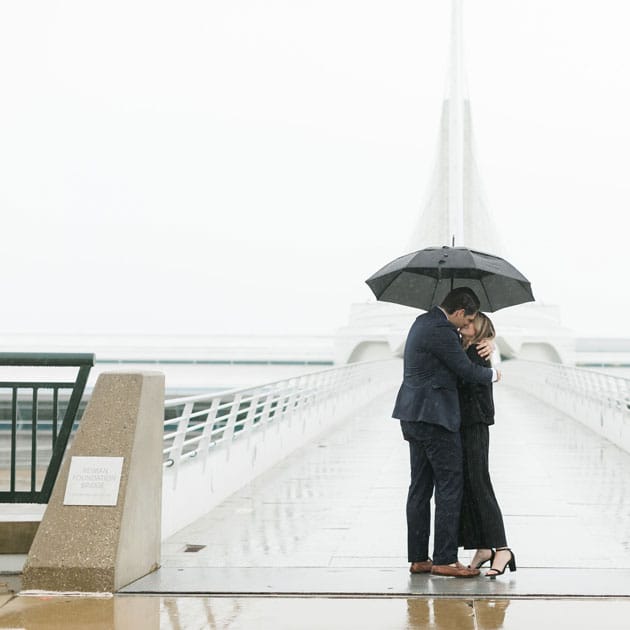 Jack and Emme kiss at the Reiman Footbridge after she says "yes!"