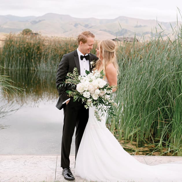 Erica and Jesse laughing together at Pepper Tree Ranch.