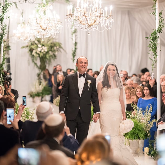 Michael and Neda walk down the aisle at their wedding at Four Seasons Westlake Village wedding.