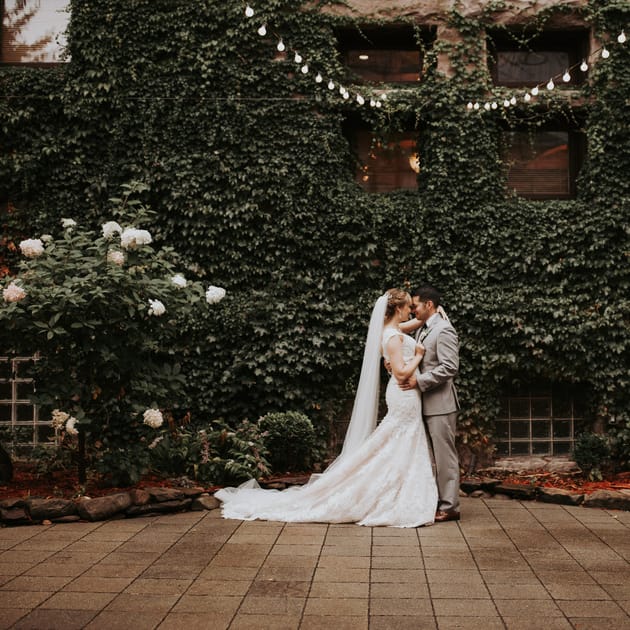 married couple outside Van Dusen Mansion